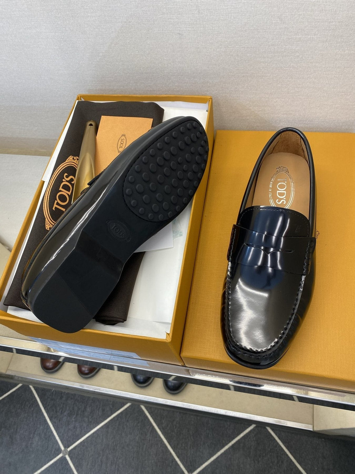 Tod's Glossy Dark Navy Penny Loafers — side